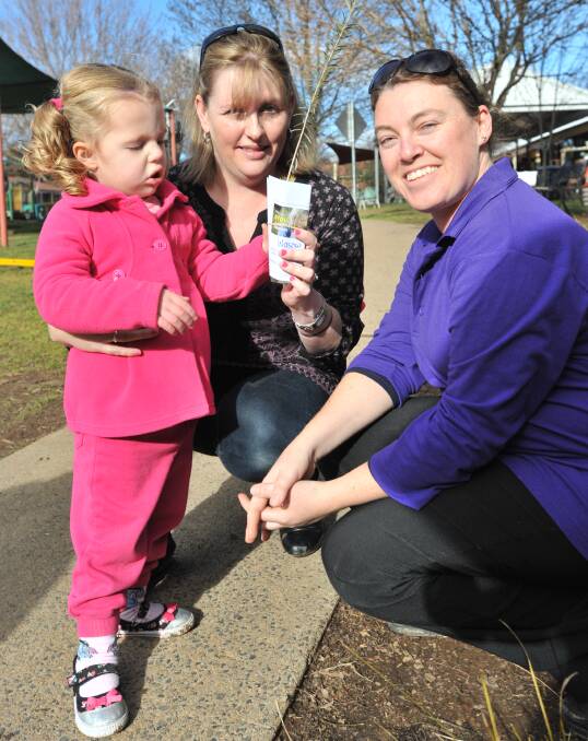 TREES OF TOMORROW: Cadence and Regina Wasow with Yarrawong Children's Centre teacher Erin Oates. PHOTO: JUDE KEOGH