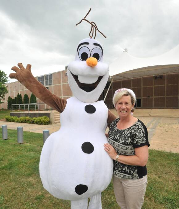 FESTIVE SPIRIT: Olaf the snowman and Orange Regional Conservatorium music director Donna Riles will make an appearance at Carols by Candlelight on Saturday night. PHOTO: Jude Keogh
