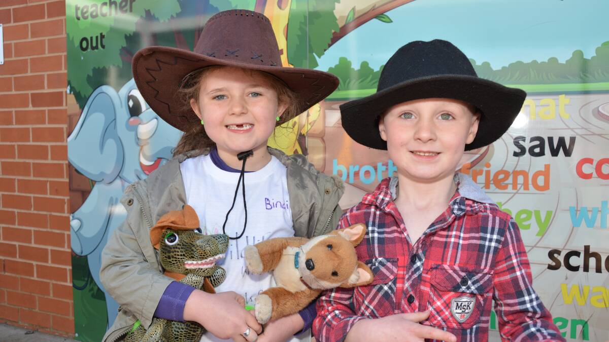 G'DAY BOOK WEEK: Kindergarten students Cienna Slingsby and Joel Brown paraded through the school with a toy crocodile and kangaroo in tow. 