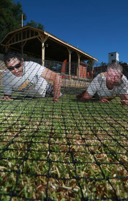WARM UP TIME: Crew members Cheyne Skennar and Benny Kreis prepare for Outback Obstacles at Towac Park Racecourse. Photo: PHIL BLATCH 0118pbobstacles3