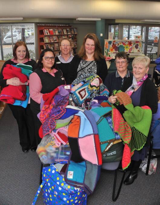 SEWN WITH LOVE: Orange Purlers members donated blankets to Housing Plus at Orange City Library last year. 