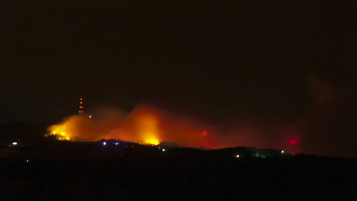 FIRE BURNING: A fire at Mr Canobolas overnight continues to burn. Photo: DEAN MALANDRIS