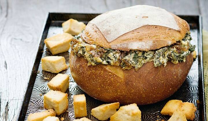 CAN YOU MAKE THIS?: Spinach and caramelised onion cob loaf, as listed at taste.com.au.