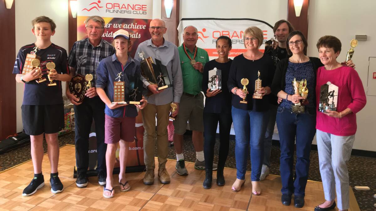 GREAT REWARD: Orange Runners Club's award winners show off their spoils from 2017, after another great year for the club. Photo: SUPPLIED