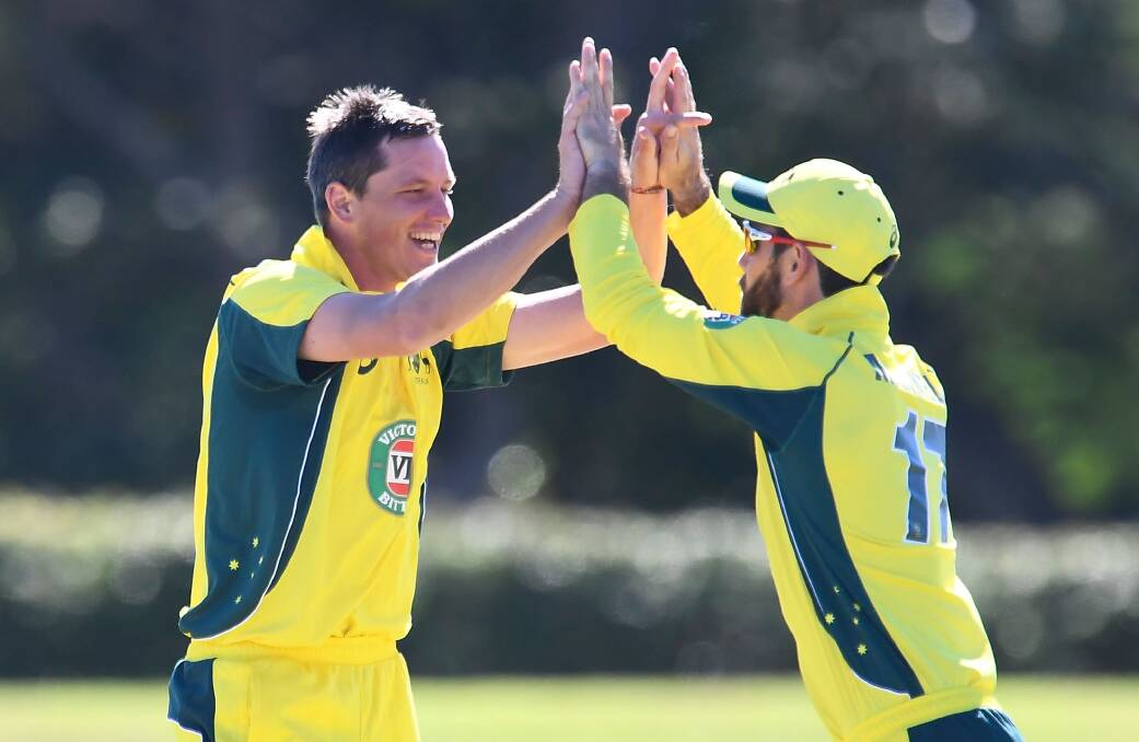 INEVITABLE SELECTION: Chris Tremain, pictured celebrating a wicket for Australia with Glen Maxwell, is shaping as a genuine new-ball option for Australia, based on his recent form for Australia A and Victoria. Photo: GETTY IMAGES
