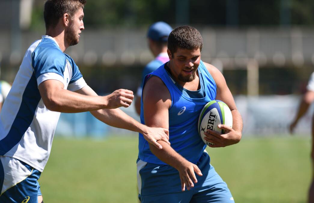 FIFTH PLACE, FIFTH PLACE: Orange products Ryan McCauley and Cody Walker, pictured training before Tuesday's clash with Italy, and their Australian side will face Scotland in the fifth-place play-off. Photo: ARU MEDIA