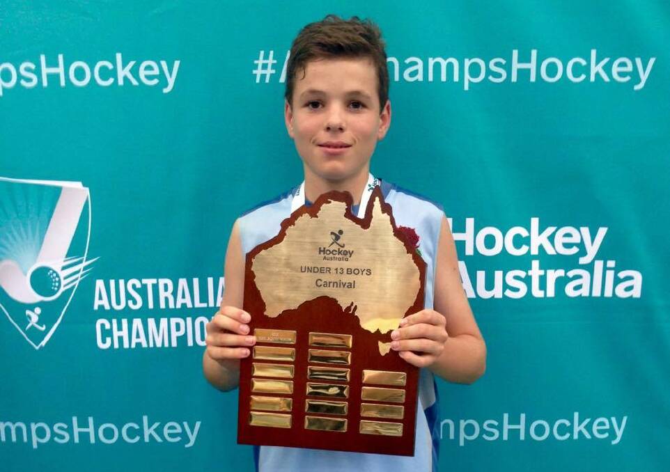 GOAL SCORER: Sam Giumelli shows off the spoils from the under-13 indoor nationals. He was superb for NSW, scoring twice during NSW's undefeated campaign.