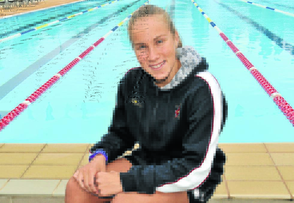 GOLDEN GAL: Orange's Emily Nobbs was electrifying in the University of Adelaide pool, picking up two Pacific School Games gold medals. Photo: STEVE GOSCH
