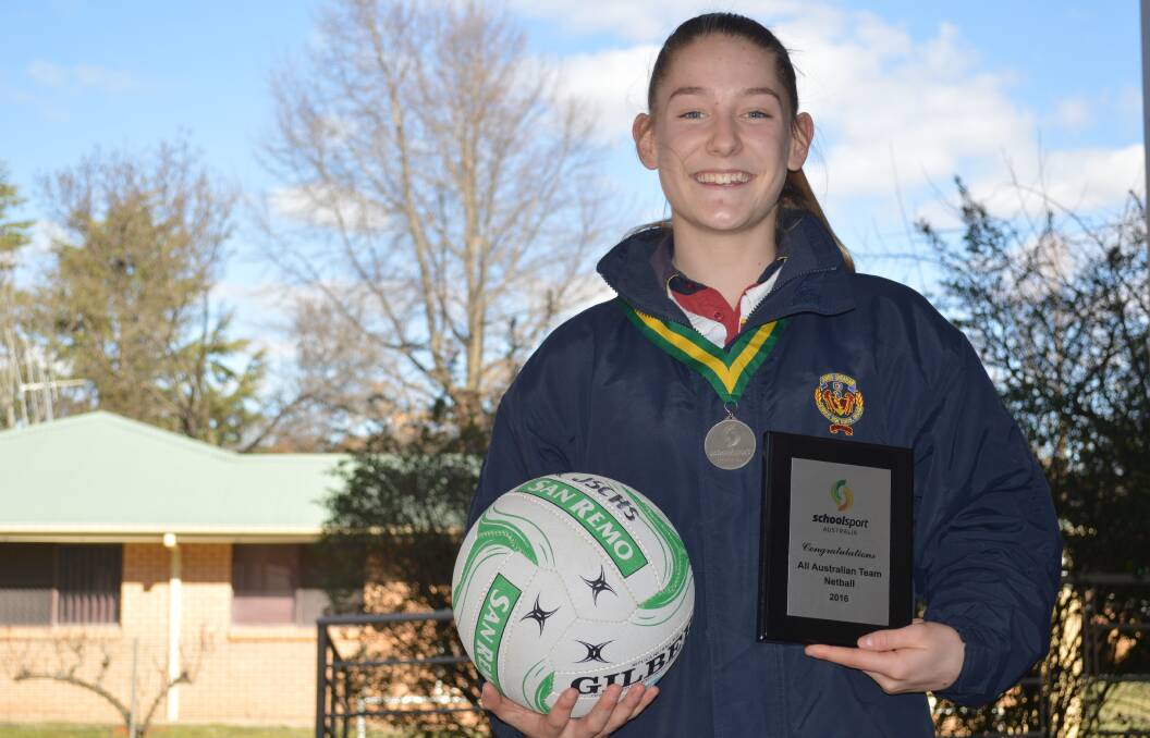 GREEN AND GOLDEN GIRL: Annie Miller, silver medal in tow, earned selection in the 15 and under Australian Schoolgirls side to head to Fiji next year. Photo: MATT FINDLAY 0808mfannie1