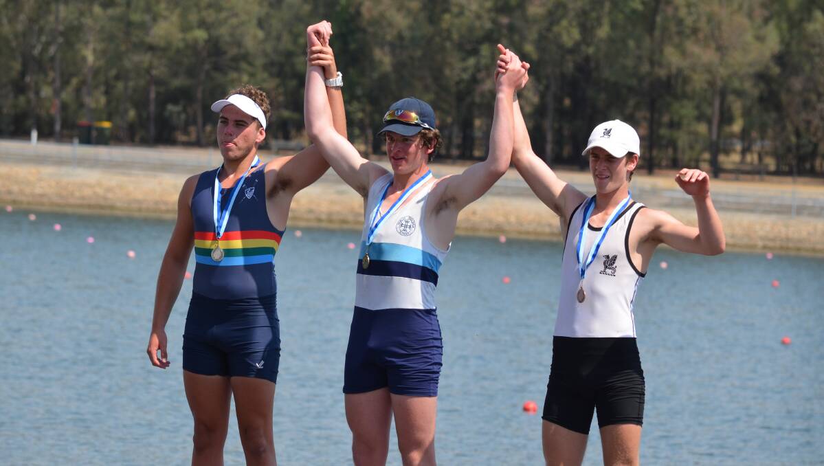 CHAMPION: Cody Kelso (centre) claimed the men's under-16 single scull championship from Lachlan Barry in second and Finn Tainsh in third (left and right, respectively). Photo: CONTRIBUTED