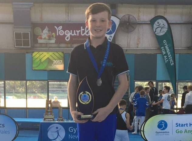 BACKING IT UP: Central West Gymnastics' Mitchel Cook shows off his MAG Level 5 country championship title, which came a year after winning the Level 4 equivalent. Photo: CENTRAL WEST GYMNASTICS