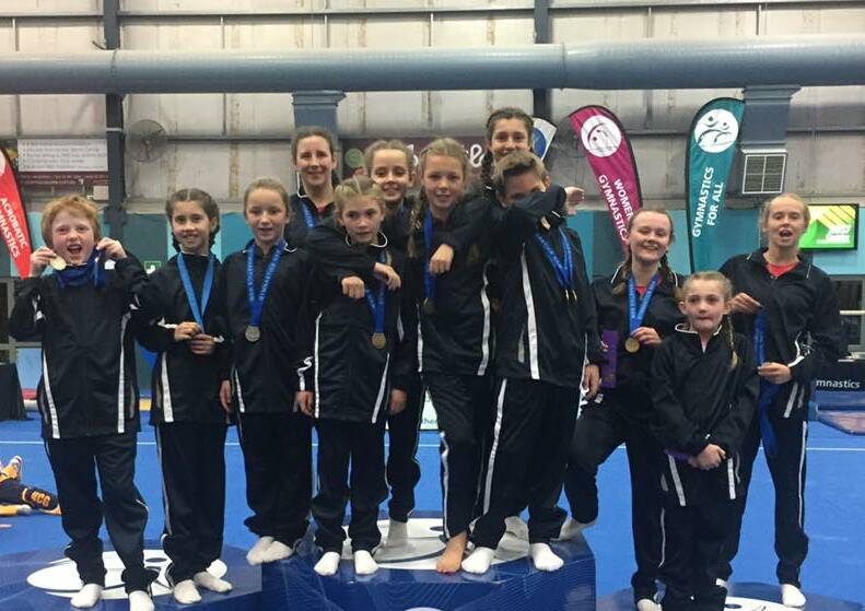 ANOTHER WIN: PCYC's gymnasts show off their swag of medals, which led to another overall trampoline country championship win. Photo: PCYC