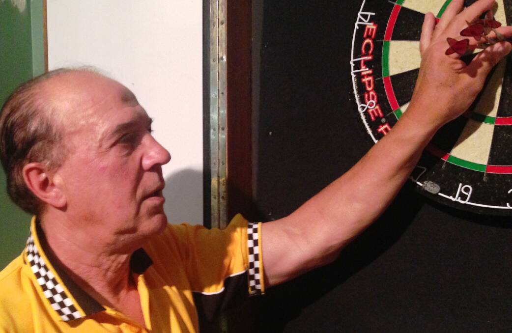CHAMPION: Ken Kostitch bagged a 180, a grand final's not a bad time to get one either. His Tigers side claimed another title. 
