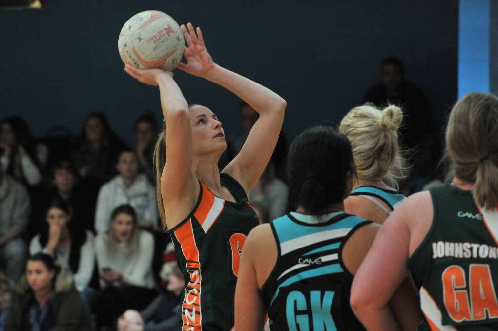 STRAIGHT SHOOTER: Boom Orange City recruit Kristin Zinga lines up a shot in the preliminary final, she takes on her old side in Saturday's grand final. Photo: JUDE KEOGH