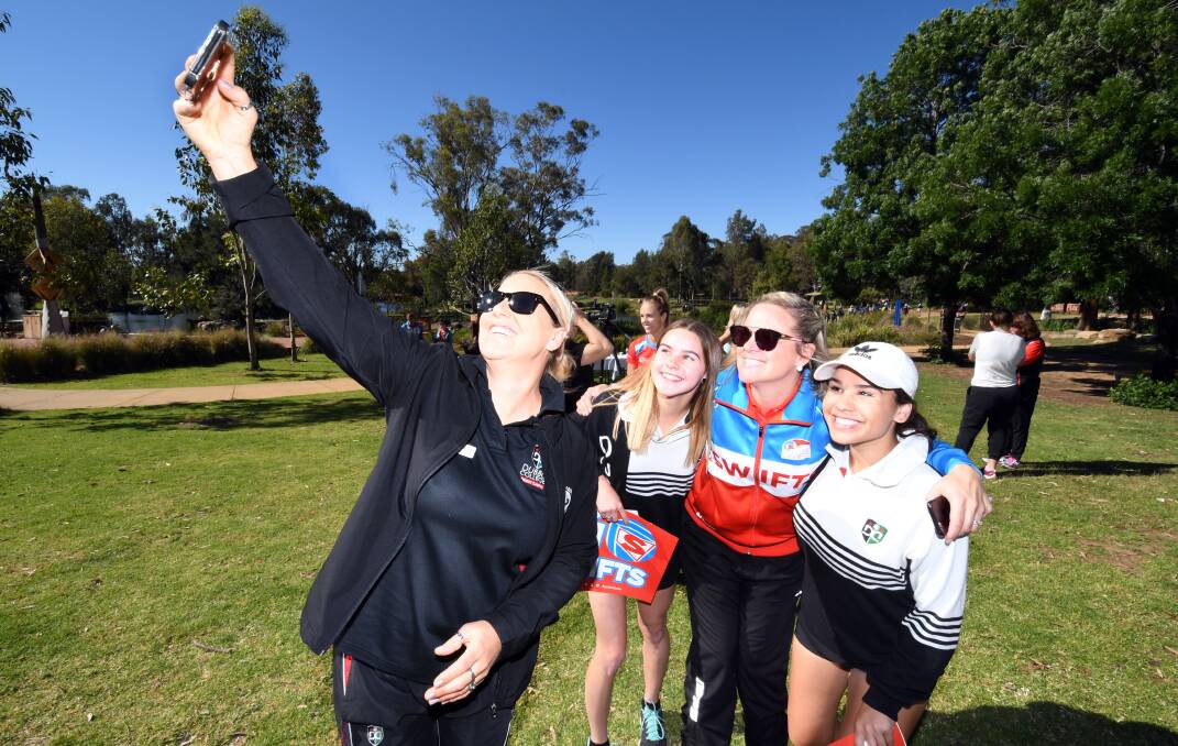 WE'LL BE BACK: Swifts coach Briony Akle takes a selfie with some adoring fans in Dubbo on Thursday morning, she was chuffed with the reception there and in Orange. Photo: BELINDA SOOLE