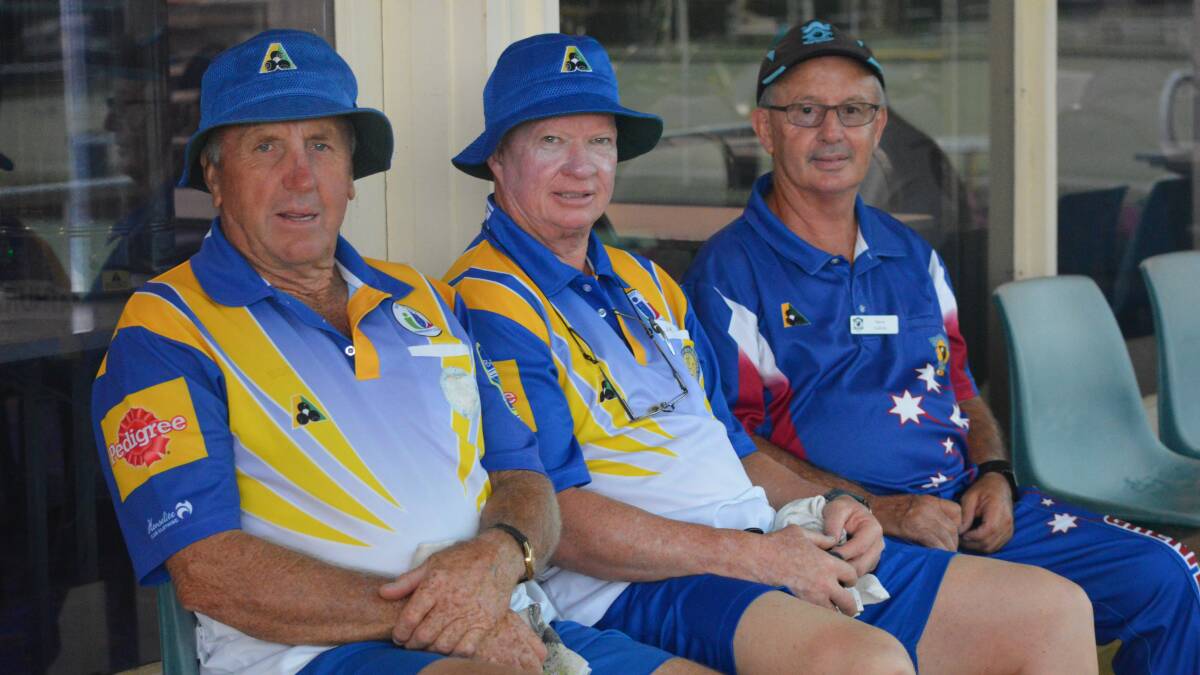 WATCHING ON: Bathurst City's Bobby Lindsay and Mick Hall, and Grenfell's Steve Galvin, watch and hope the rain stops on Monday afternoon. Photo: MATT FINDLAY