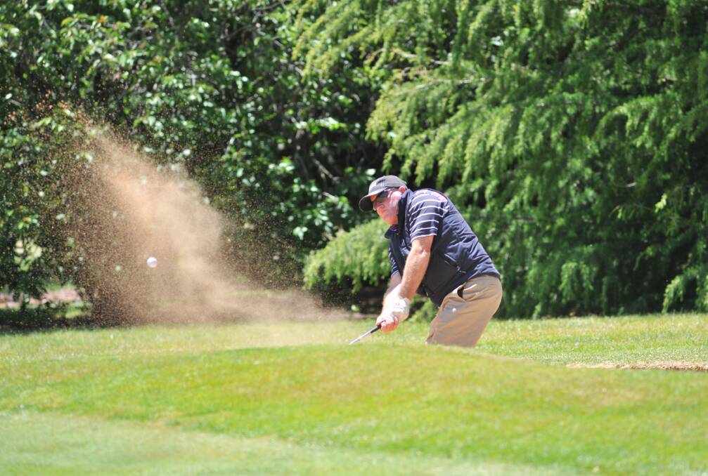 SPLASHDOWN: Gary Rudd blasts one out of a bunker at Duntryleague. Photo: JUDE KEOGH