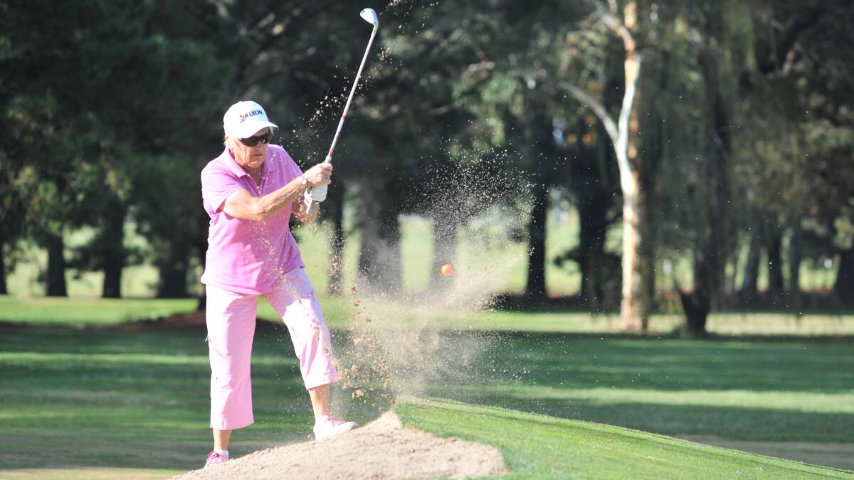 SPLASHDOWN: Country Club's Val Lynch splashes out of a bunker on Wednesday's final day of play. Photo: JUDE KEOGH