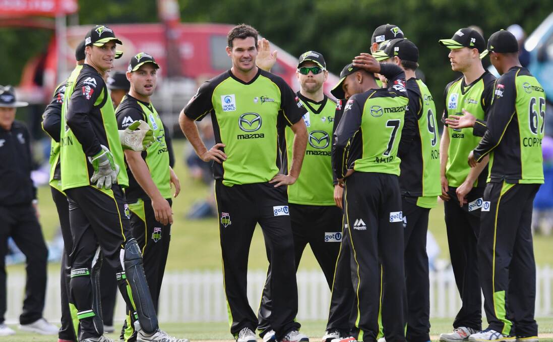 RETURNING STAR: Clint Mackay (middle) celebrates a wicket with his Thunder teammates in their loss to Canterbury last Friday. Photo: GETTY IMAGES