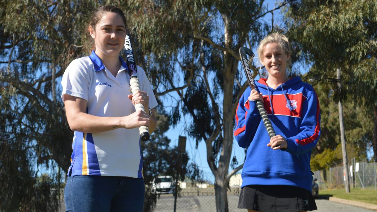 POLAR OPPOSITES: Ex-Services striker Jade Williams admitted Saturday's derby has a much different feel to it, while Feds recruit Rachel Hoey is looking forward to taking the field in her first all-Orange clash. Photo: MATT FINDLAY