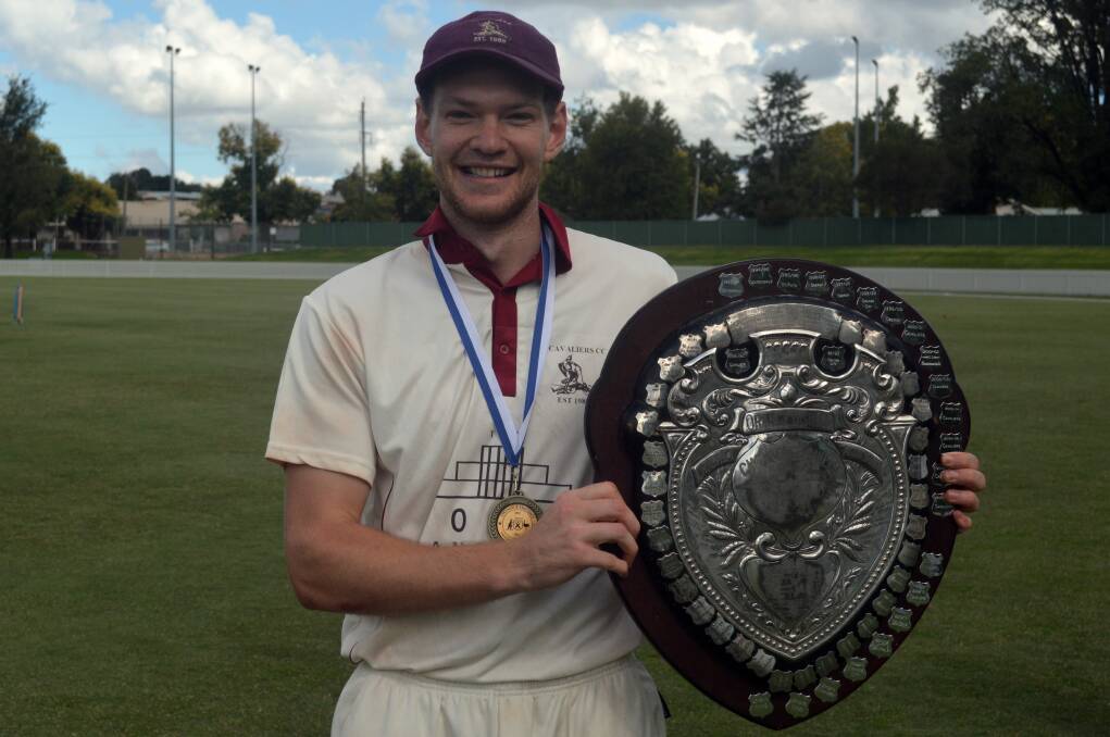 THE MVP: Cavaliers skipper Matt Corben shows off his spoils from the grand final win, the man-of-the-match medal and the coveted Challenge Shield. Photo: MATT FINDLAY