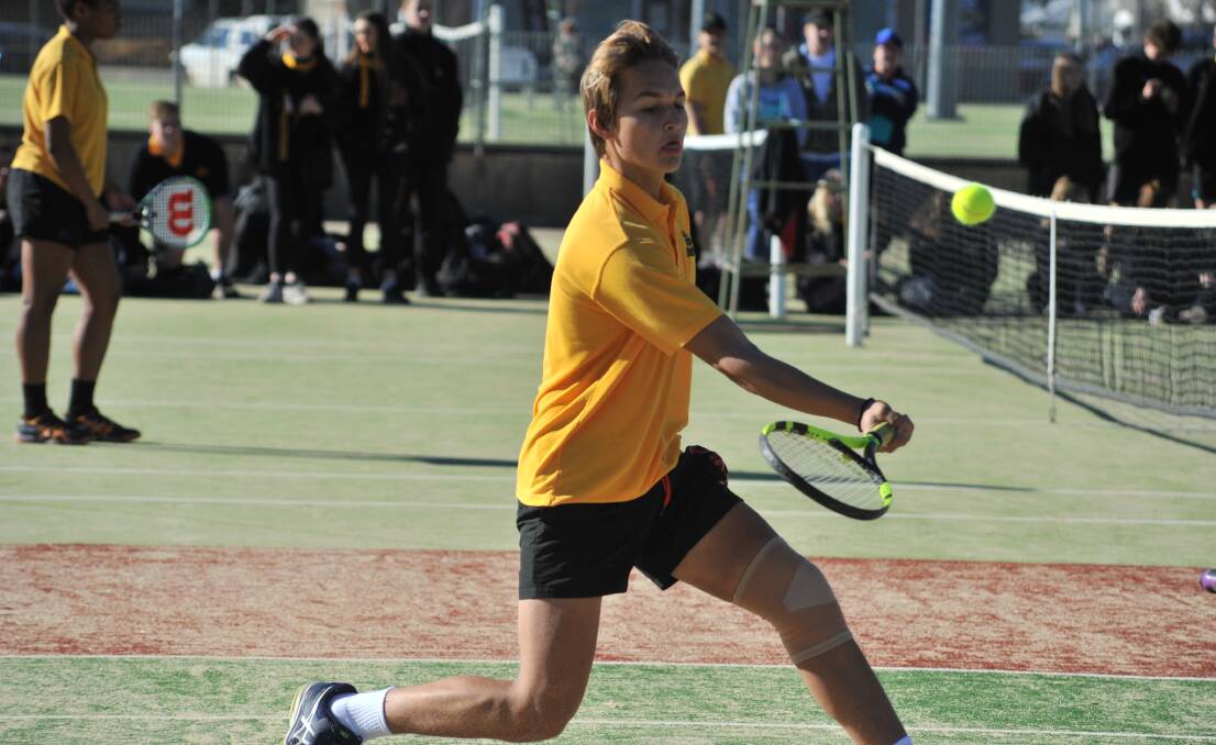 BLACK AND GOLD ARMY: Aleks Radojicic lays on a drop shot in Thursday's Astley Cup tennis tie at Ex-Services' courts. Photo: JUDE KEOGH