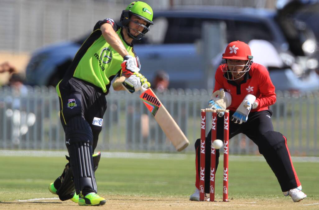 HITTING OUT: Sydney Thunder young gun Kurtis Patterson pummels one through cover in his innings of 43 in Sunday's second game. Photo: PHIL BLATCH