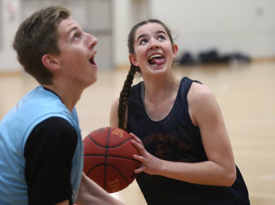DROPPING DIMES: Kobe Mansell and Emily Matthews put Seebohm's advice into action. Photo: PHIL BLATCH 0720pbpcyc10