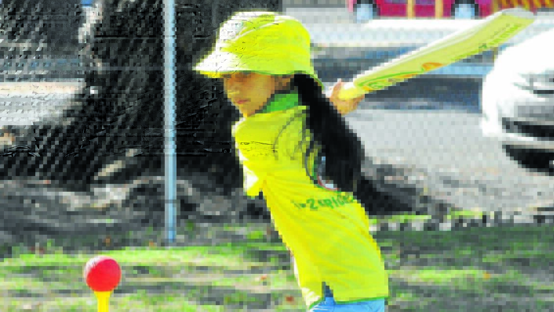 CHANGES COMING: Simran Dhatt winds up at Wade Park last year. The changes to junior cricket come in this summer. Photo: JUDE KEOGH