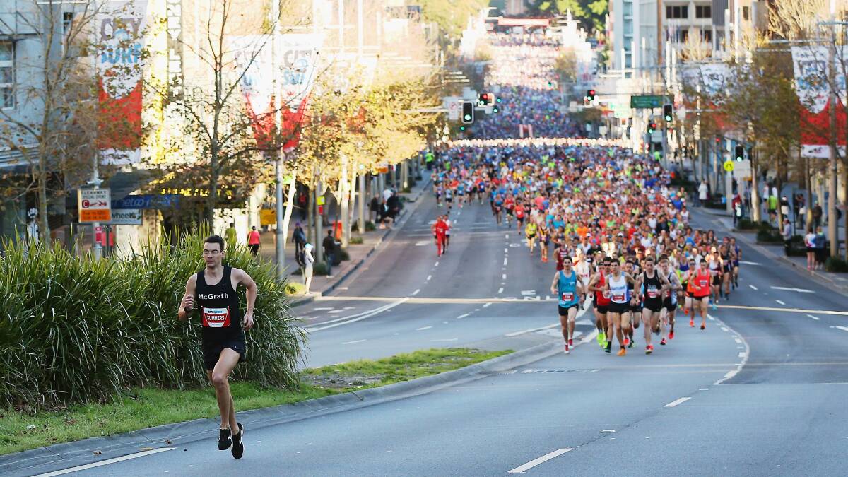 UNDENIABLE FAVOURITE: Harry Summers, pictured blitzing the City2Surf, returns to defend his Athlete's Foot Half Marathon crown this weekend. Photo: GETTY IMAGES