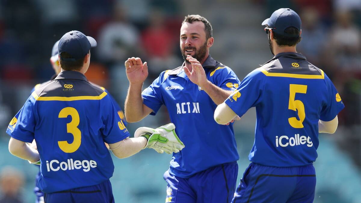 IN FULL FLIGHT: Mick Delaney celebrates his sole wicket in the ACT XI's loss to PNG on Wednesday. He snared 1-31 from three overs at Manuka Oval. Photo: GETTY IMAGES