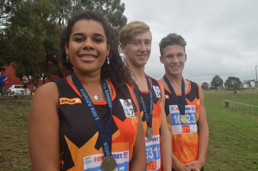 MEDAL WINNERS: Ebony Hay, Jackson Willis and Ollie Keegan dominated the Little Athletics NSW Track and Field Championships. Photo: MATT FINDLAY