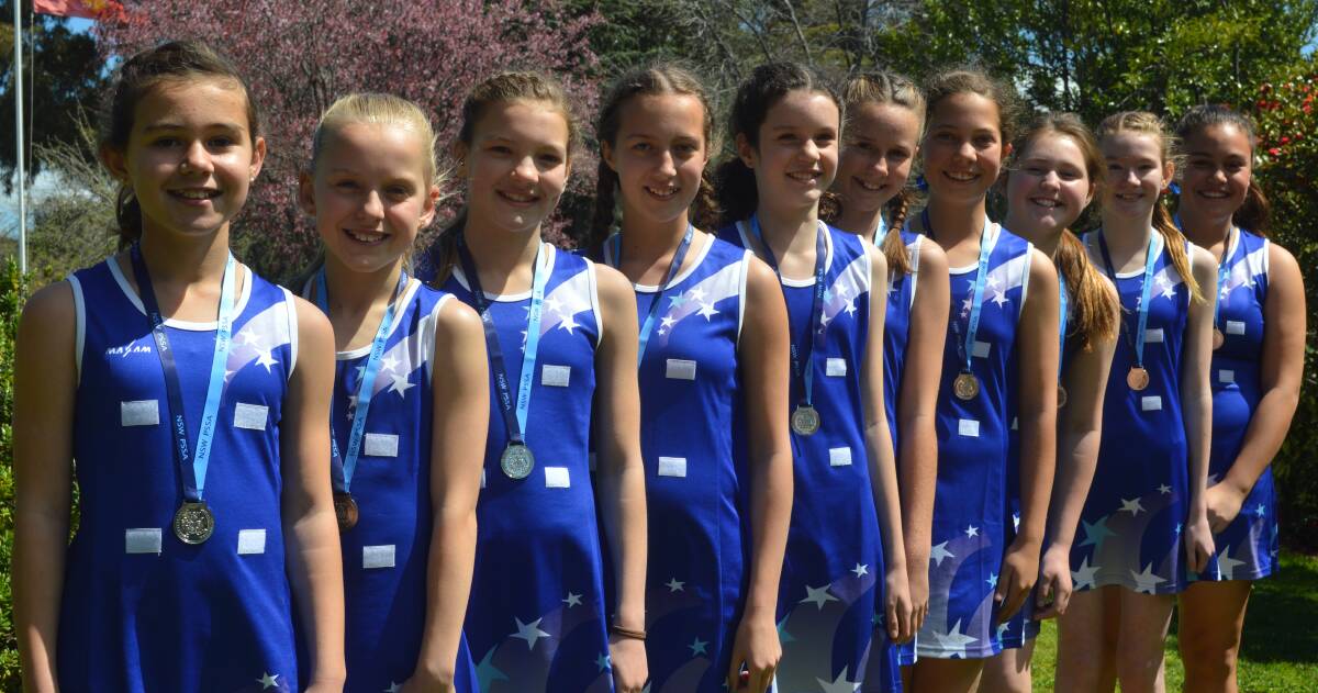 GREAT EFFORT: Calare Public School's uber-talented netball side proudly show off their NSWPSSA Knockout silver medals. Photo: MATT FINDLAY