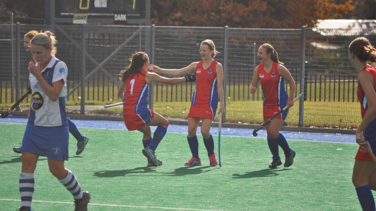 A REAL THREAT: Eva Reith-Snare (No.1), Maggie Smith and Pip Mannix celebrate a goal in Confederates' 2-1 win over St Pat's. The two sides meet again on Saturday. Photo: NICK McGRATH