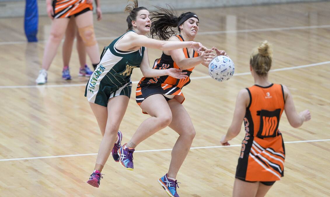 HARD AT IT: Kellie Watson battles for possession with a Newcastle opponent. Orange's young side finished sixth at the State Cup. Photo: SMP IMAGES