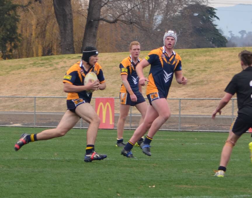 GAME ON: Bathurst High's Luke Ayoub takes a hit-up during his school's crucial rugby league victory, which came thanks to a stunning comeback. Photo: BRADLEY JURD