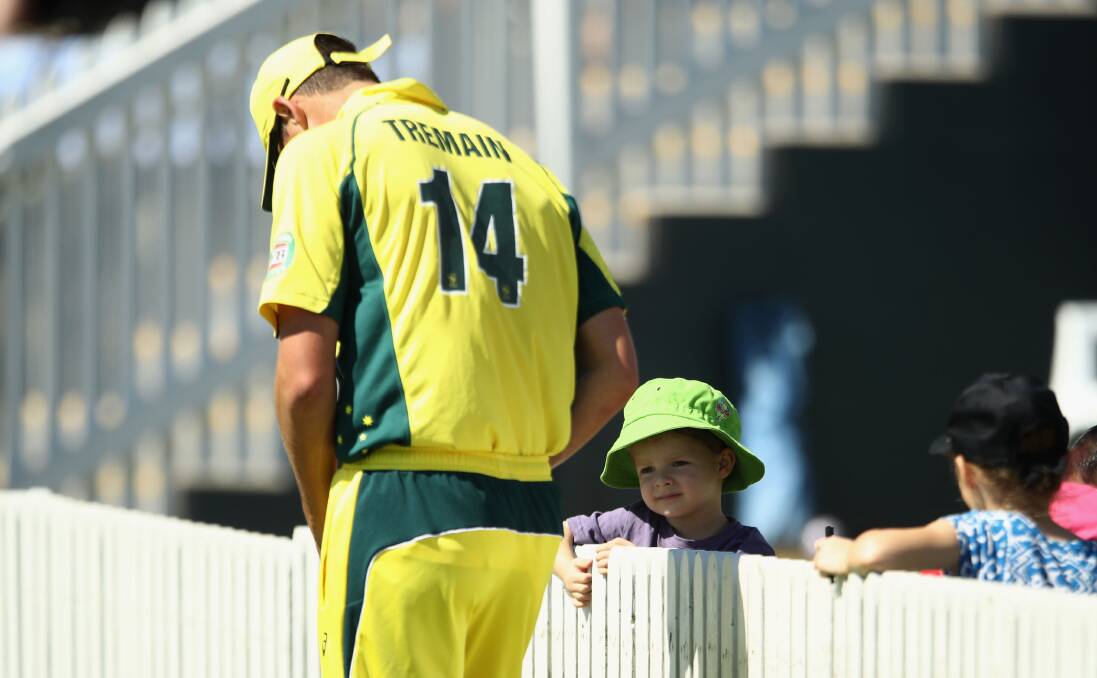 GET USED TO IT: Chris Tremain makes a kid's day during the recent Australia A Quadrangular Series. Photo: GETTY IMAGES