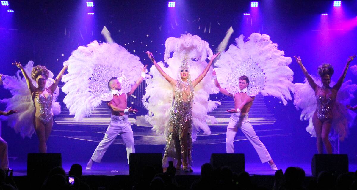 FEATHERS EVERYWHERE: Prada Clutch (centre) with some of her 'girls' as part of Prada's Priscillas: An All-Male Revue. Photo: SUPPLIED