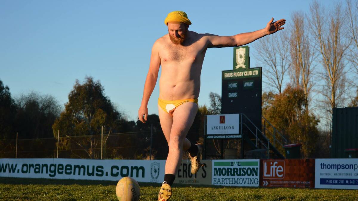 MEDIOCRITY PERSONIFIED: Damien 'Damo' Harton in his beer glass Budgys at the Emus Rugby Club. Photo: MATT FINDLAY