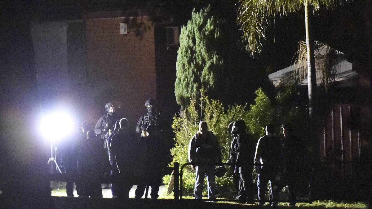 Police presence: Tactical police outside the home on Chopin Street during the stand-off. Picture: Wolter Peeters