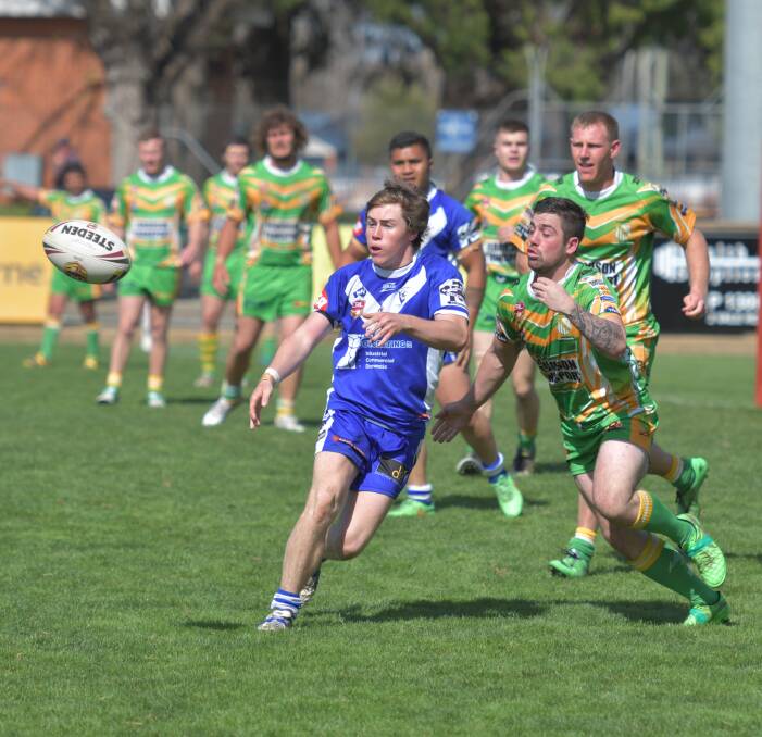 OUT OF THE HUNT: Jared Colling delivers the ball to a St Pat's teammate in Sunday's Group 10 first division 26-16 loss to Orange CYMS at Carrington Park. Photo: ALEXANDER GRANT 091116agpats1