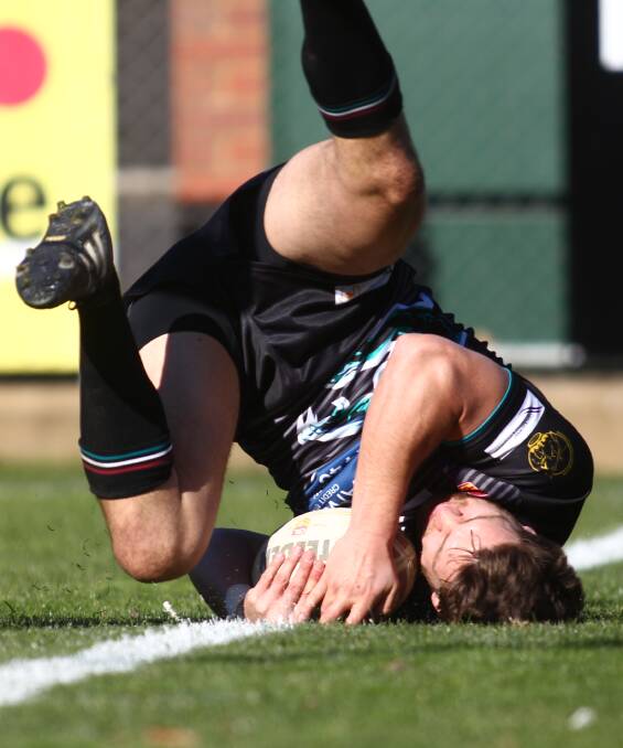 GOT IT: Leigh Monaghan gets on the end of a grubber kick to score the second of six Bathurst Panthers tries on Sunday. Panthers beat the Cowra Magpies 35-24. Photo: PHIL BLATCH 073116pbpanthers4