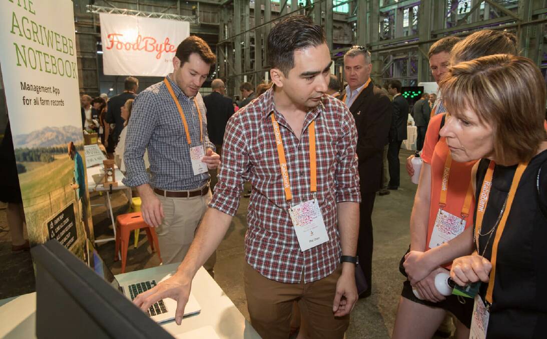 AgTech on show: Co-Founder John Fargher (left) and CTO Phil Chan (front) demonstrate the AgriWebb Notebook at the Rabobank Foodbytes Farm2Fork Competition.