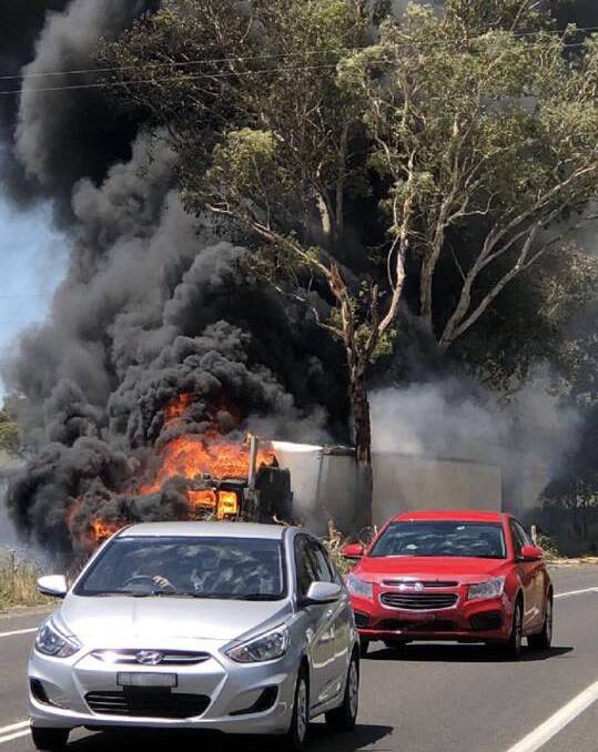 UP IN FLAMES: The truck which crashed into a tree and caught on fire on the Lachlan Valley Way south of Cowra on Sunday afternoon. Photo: SUPPLIED