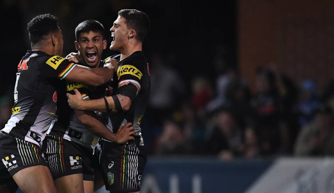 CHEER: Tyrone Peachey (centre) and
the Panthers during their win at Bathurst
this year. Photo: AAP/DEAN LEWINS