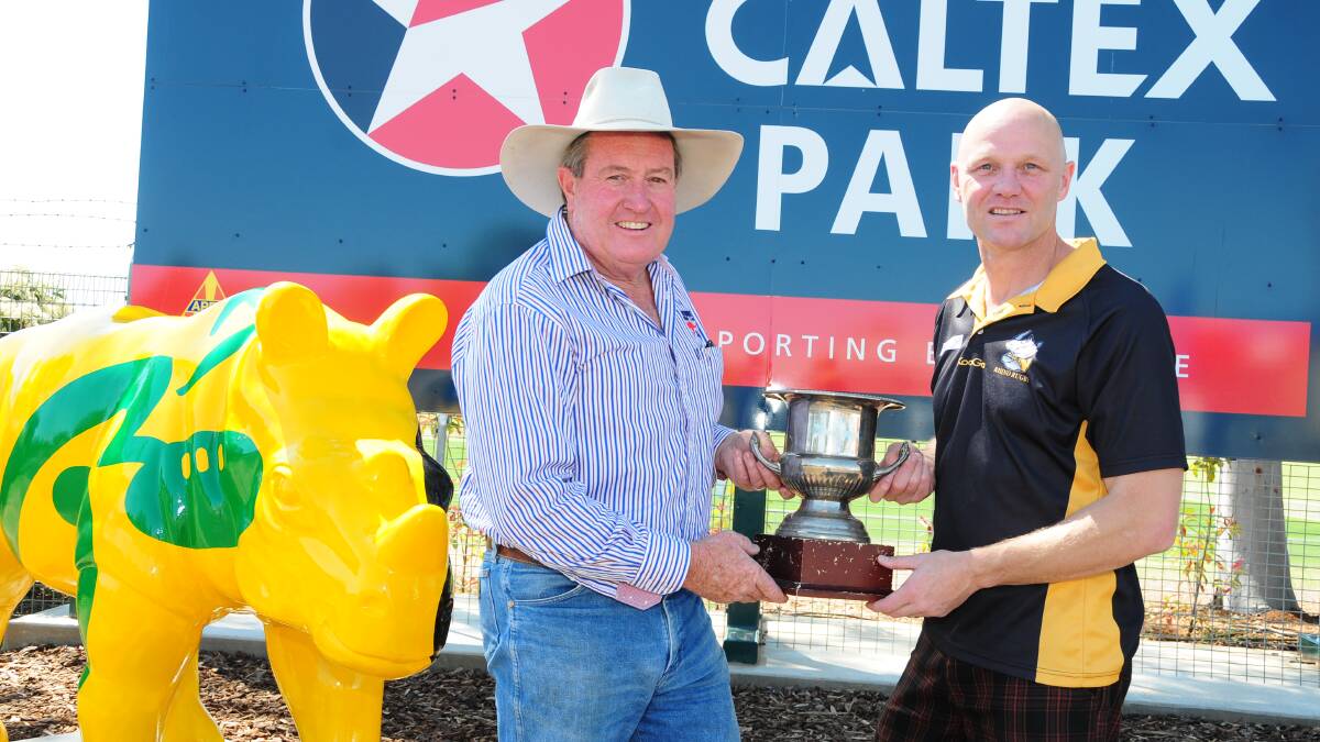 THAT TIME AGAIN: Dubbo Kangaroos and Dubbo Rhinos respective presidents Graeme Board and Ian Burns with the Mark Melville Cup in recent years. Photo: BELINDA SOOLE