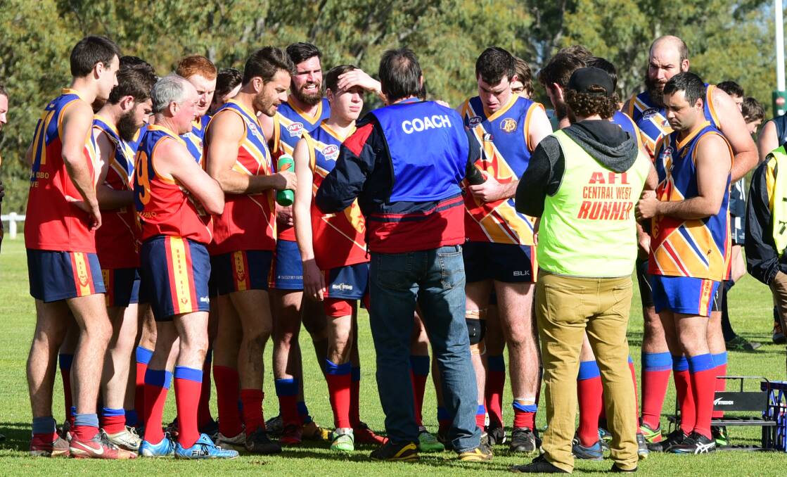 IN CONTROL: The Dubbo Demons squad pays close attention to the words of Will Bunt during a match in the 2016 season. Photo: BELINDA SOOLE