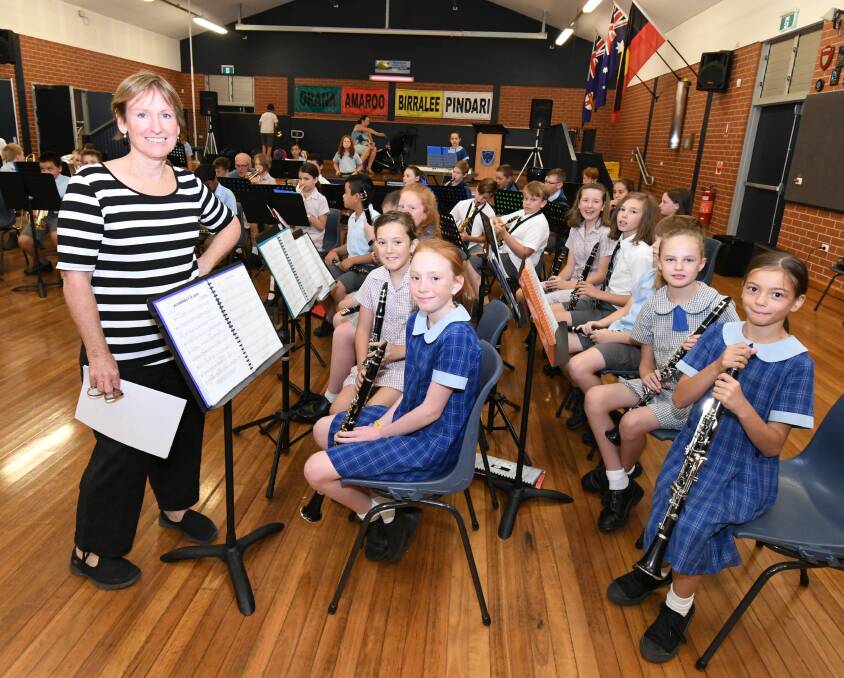 LIVE AND LOCAL: Music teacher Chris Mickle with music students from Canobolas Public School, Calare Public School and Bletchington Public School. 0207jkband1