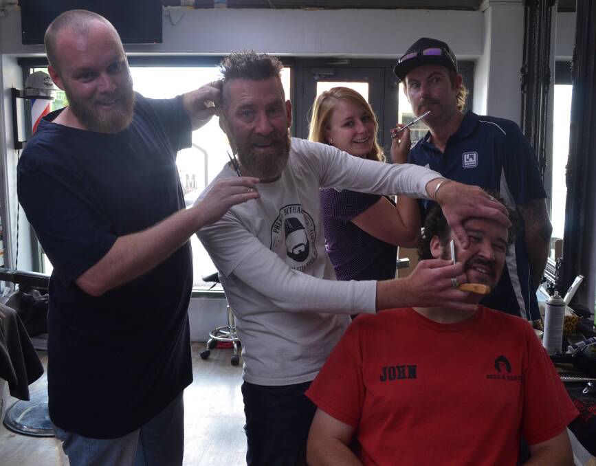 MO SNIP: Pat Hodgson, Dan Smith, Rose Hodgins, John Leabeater and Josh Cheney ahead of Thursday's shave. Photo: ALEX CROWE