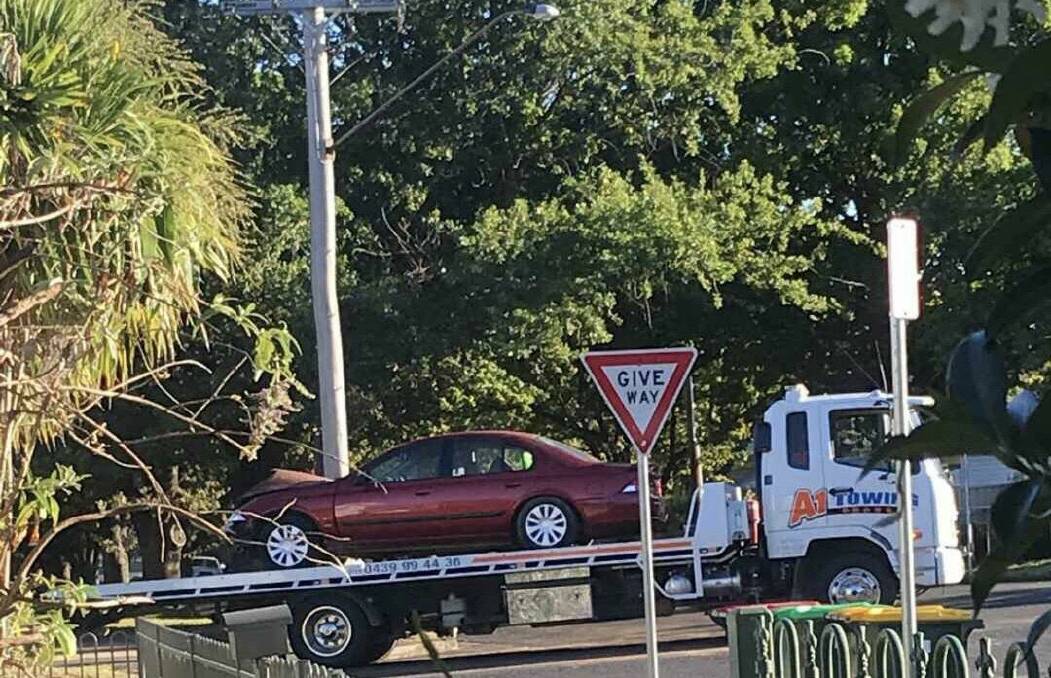 AUTUMN CRASH: A car is towed from the Autumn and Summer Street intersection following its collision with a truck on Tuesday morning.